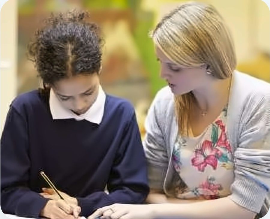 A pupil working with a member of staff