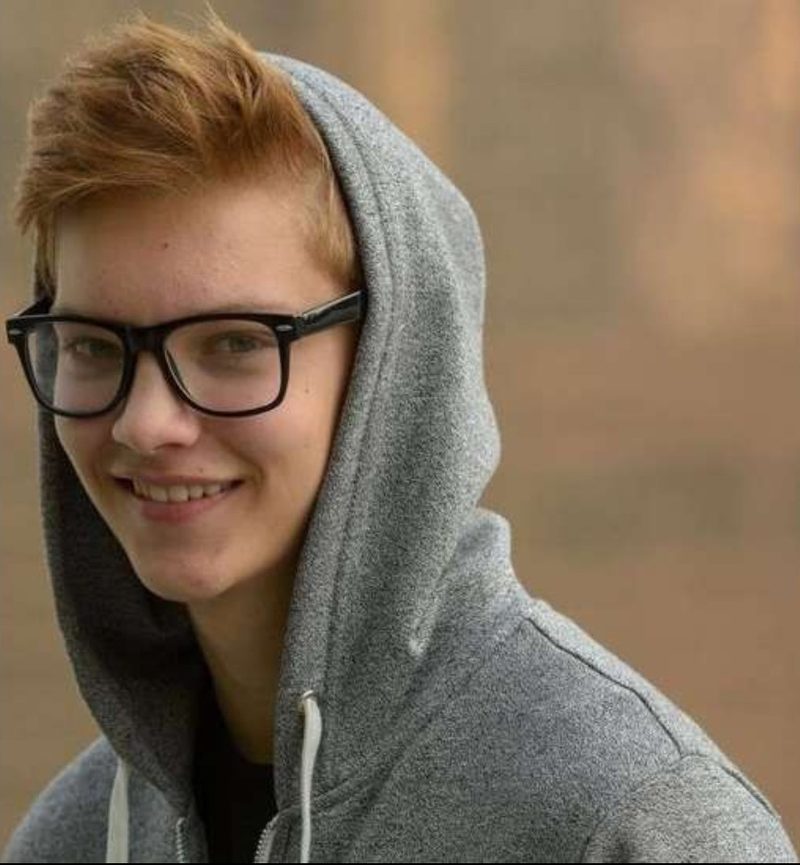 A young person smiling